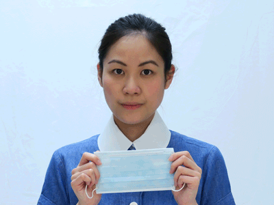 Put on Surgical Mask             a) Choose the appropriate mask size;	(1) Coloured side should face outwards; (2) pleats downwards; (3) uppermost nose strip.             b) Position the elastic bands around both ears. ;             c) Mold nose strip over nose bridge.             d) Surgical mask should fully cover mouth, nose and chin, and fit snugly over the face.